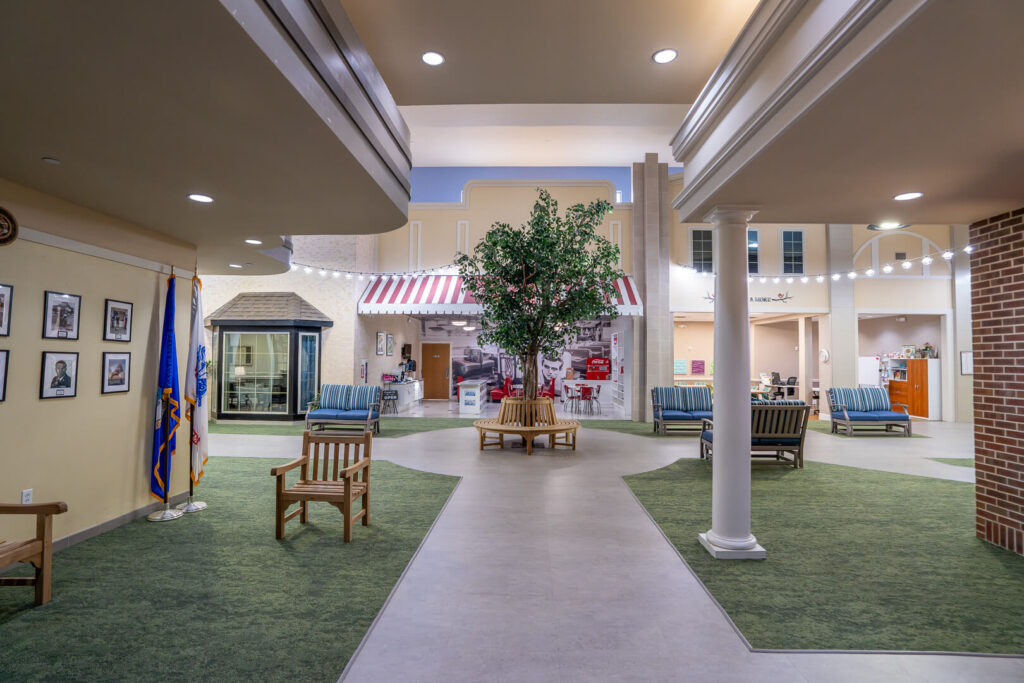 Open Atrium with Tree Bench Seating at Memory Care Homes