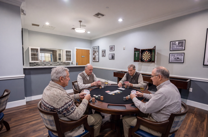 Elderly Men Playing Cards in Game Room at Memory Care Community Elderly Men Playing Cards in Game Room at Memory Care Community